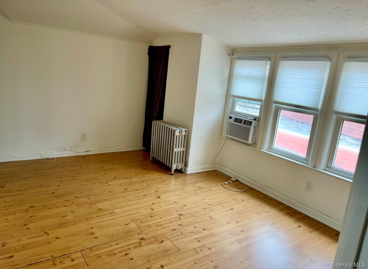 372 East 235th Street Bronx, NY 10470 - Photo 23 of 36 an empty room with windows