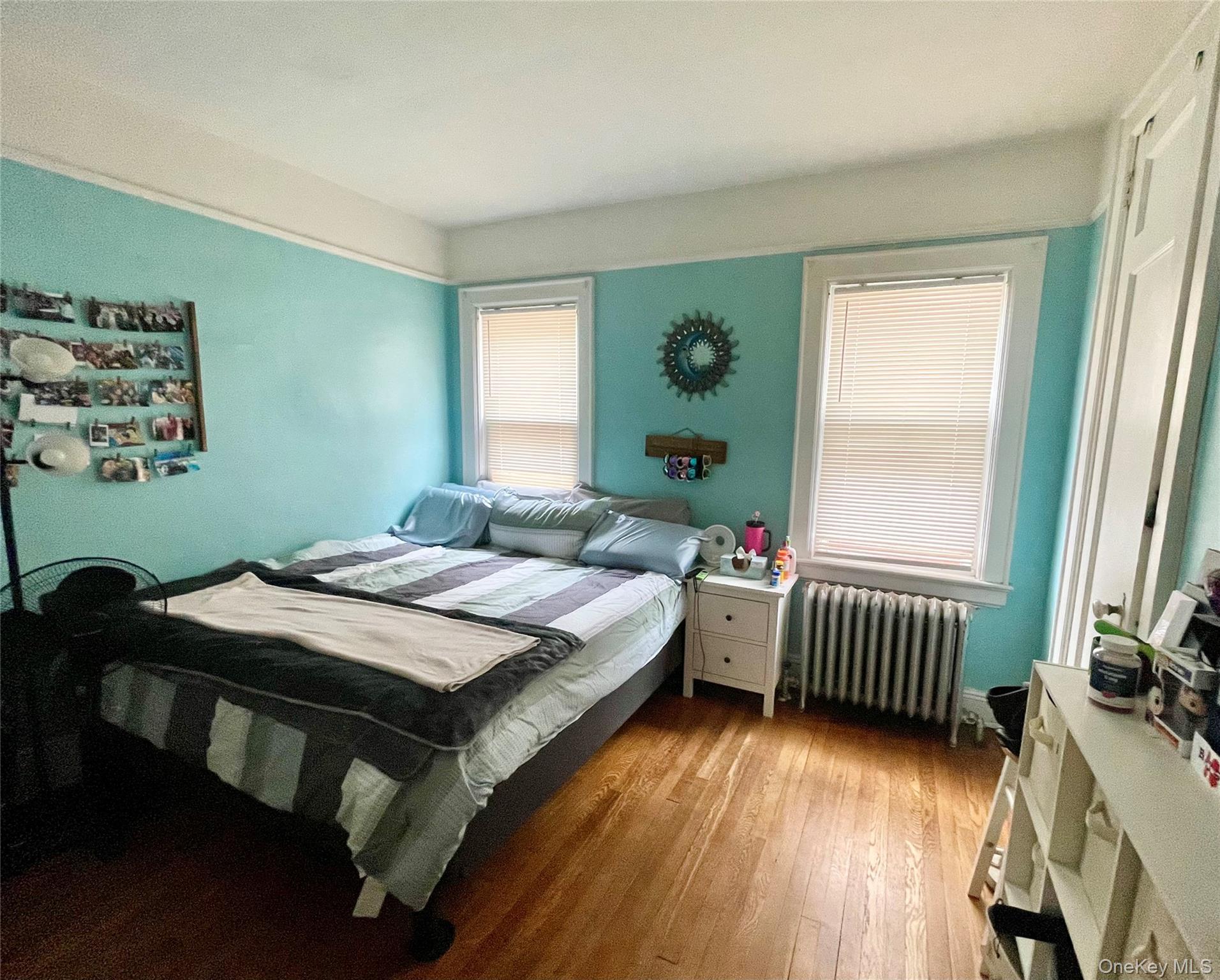 372 East 235th Street Bronx, NY 10470 - Photo 8 of 36 a bedroom with a bed and a window