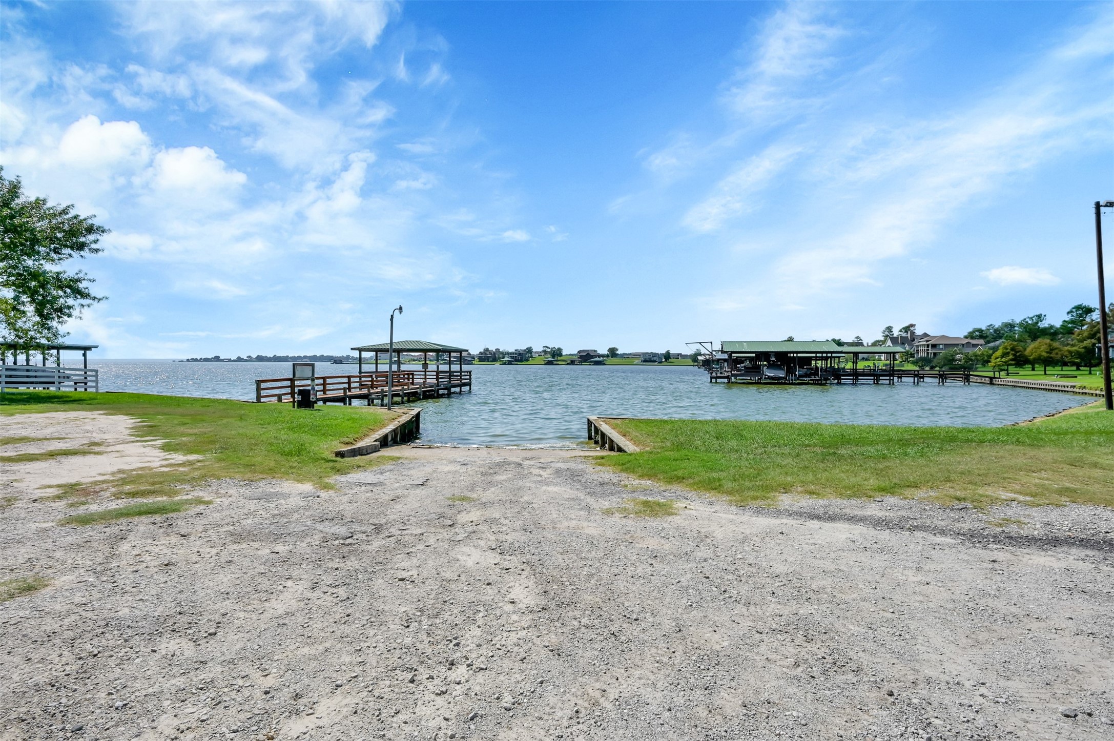 Tbd Cedar Point Livingston, TX 77351 - Photo 4 of 23 a view of a lake with houses in the back
