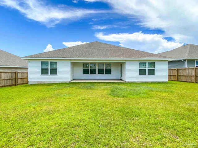 a house with swimming pool in front of it