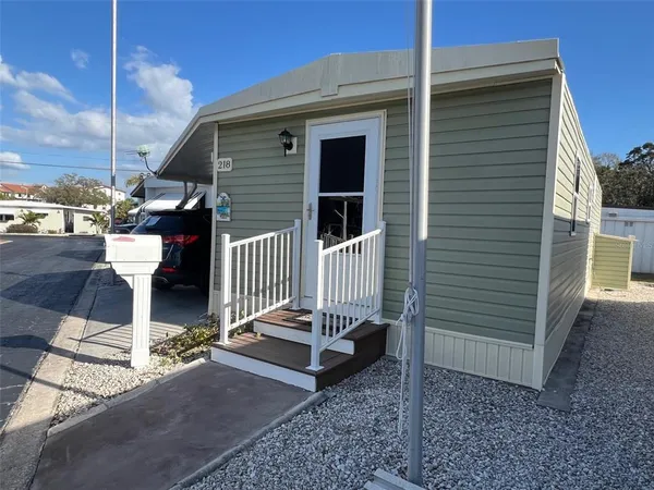 a side view of a house with a yard