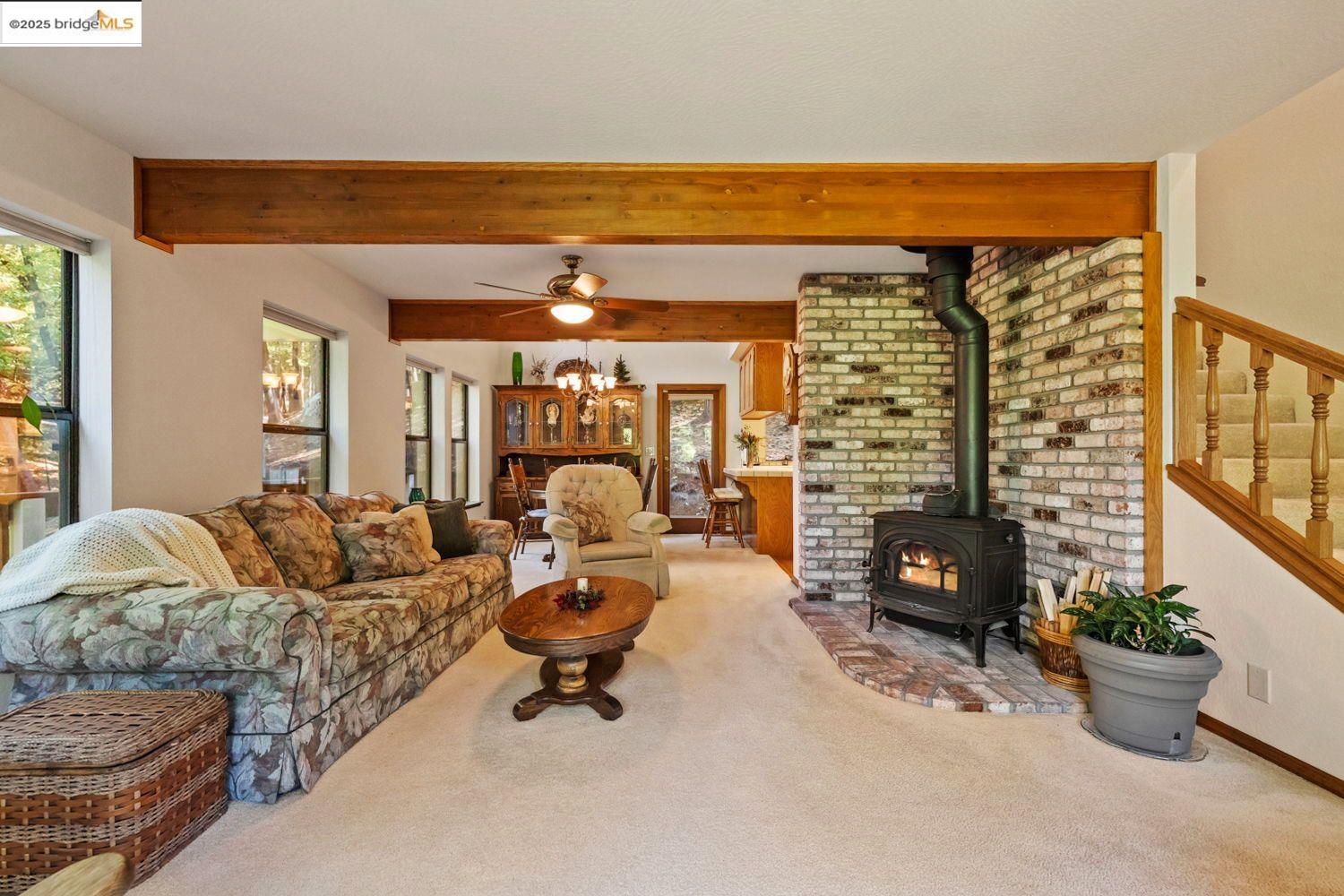 24181 Awahanee Road Sonora, CA 95370 - Photo 11 of 48 a living room with furniture and a fireplace