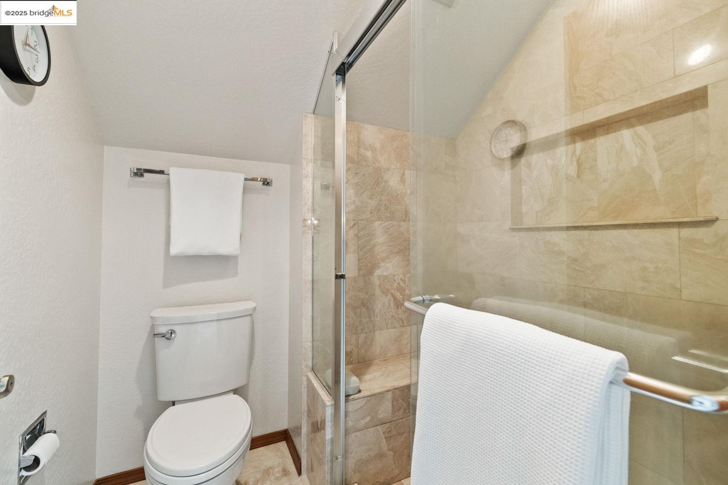 24181 Awahanee Road Sonora, CA 95370 - Photo 17 of 48 a bathroom with a toilet and shower