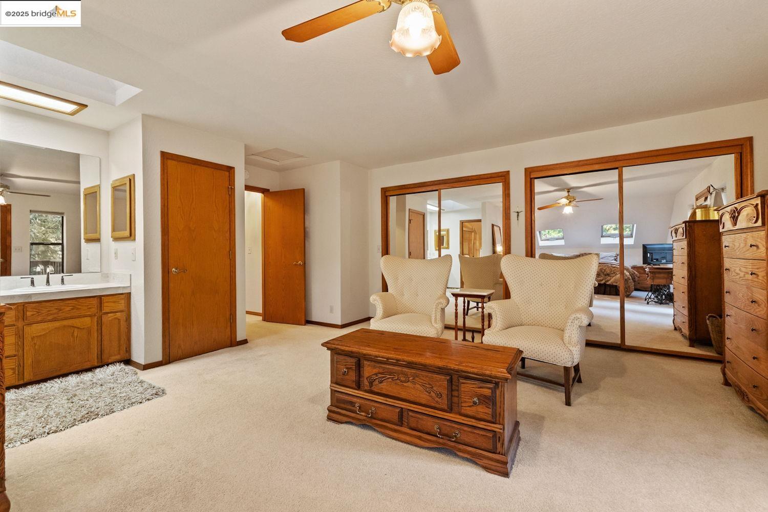 24181 Awahanee Road Sonora, CA 95370 - Photo 18 of 48 a bedroom with furniture and large windows