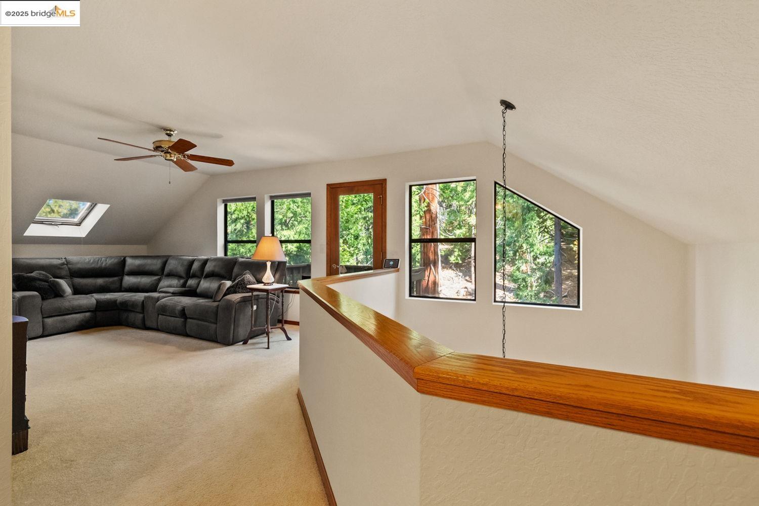 24181 Awahanee Road Sonora, CA 95370 - Photo 20 of 48 a living room with furniture and a chandelier