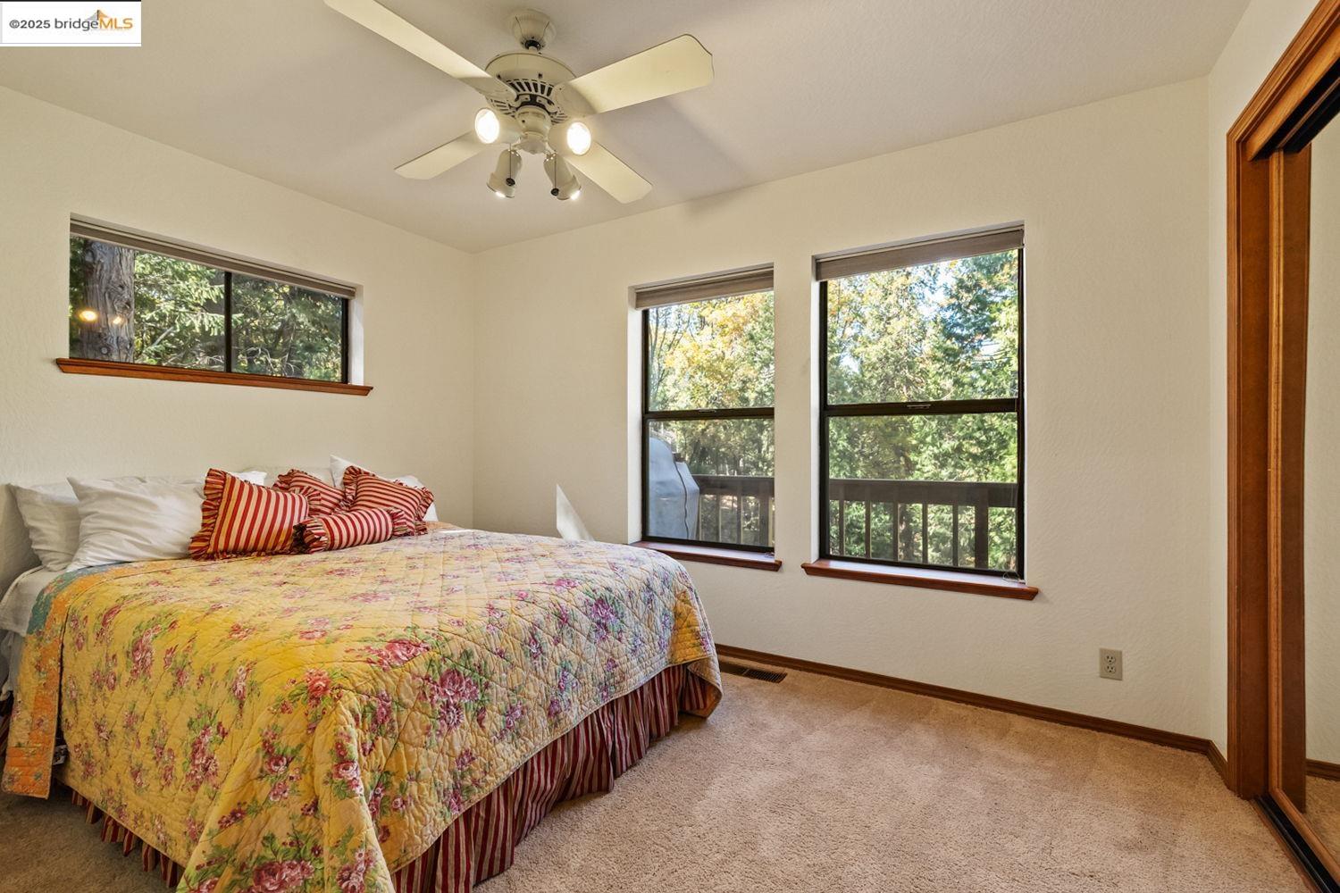 24181 Awahanee Road Sonora, CA 95370 - Photo 31 of 48 a bedroom with a bed and a window