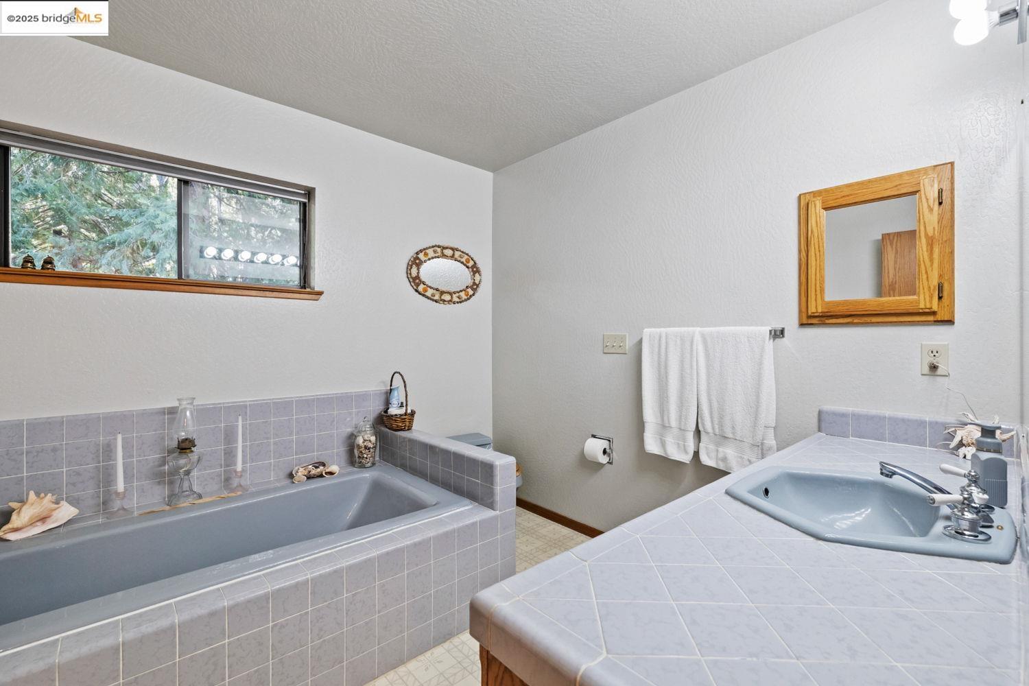 24181 Awahanee Road Sonora, CA 95370 - Photo 33 of 48 a bathroom with a double vanity sink and a mirror