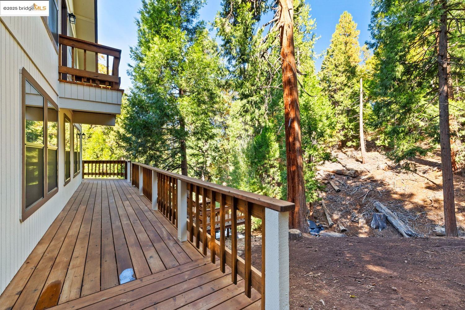 24181 Awahanee Road Sonora, CA 95370 - Photo 37 of 48 a view of balcony with wooden floor and fence