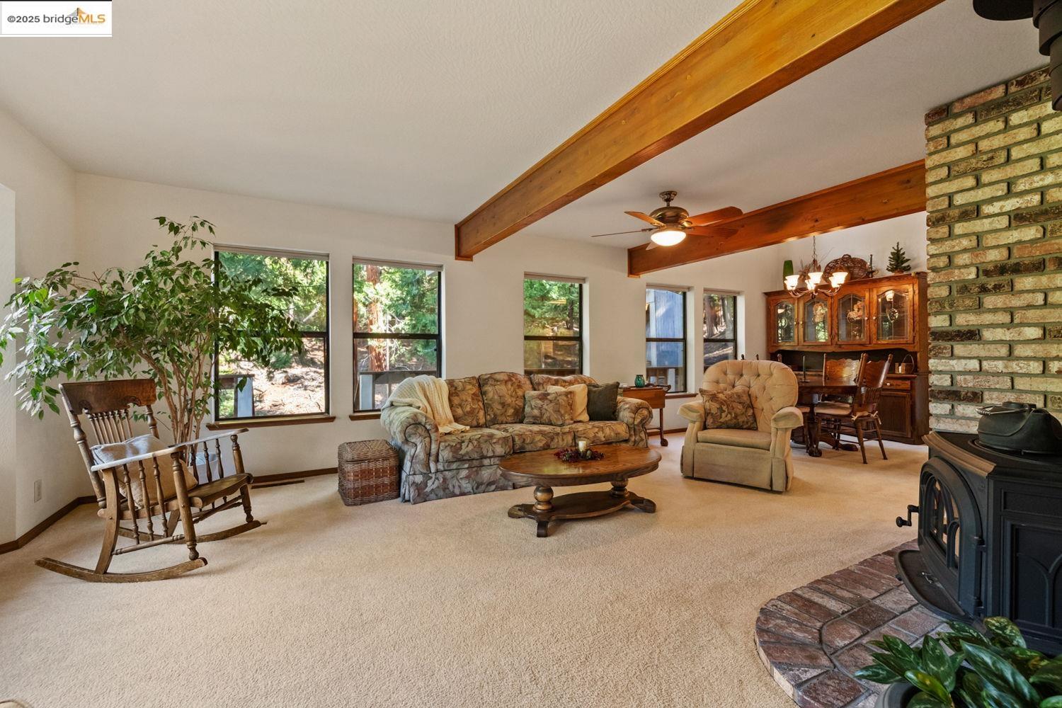 24181 Awahanee Road Sonora, CA 95370 - Photo 8 of 48 a living room with furniture and a large window