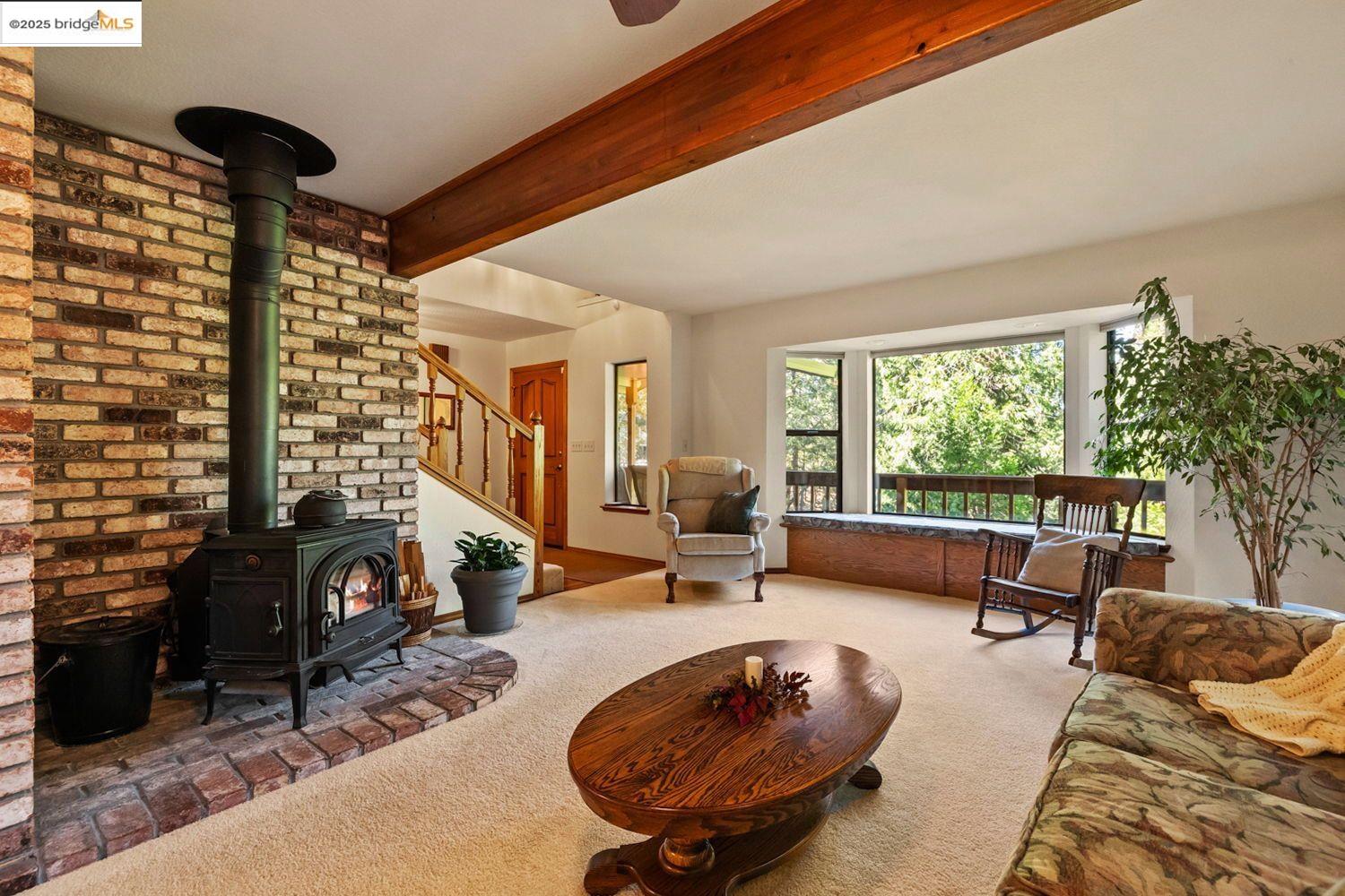 24181 Awahanee Road Sonora, CA 95370 - Photo 9 of 48 a living room with furniture and a large window