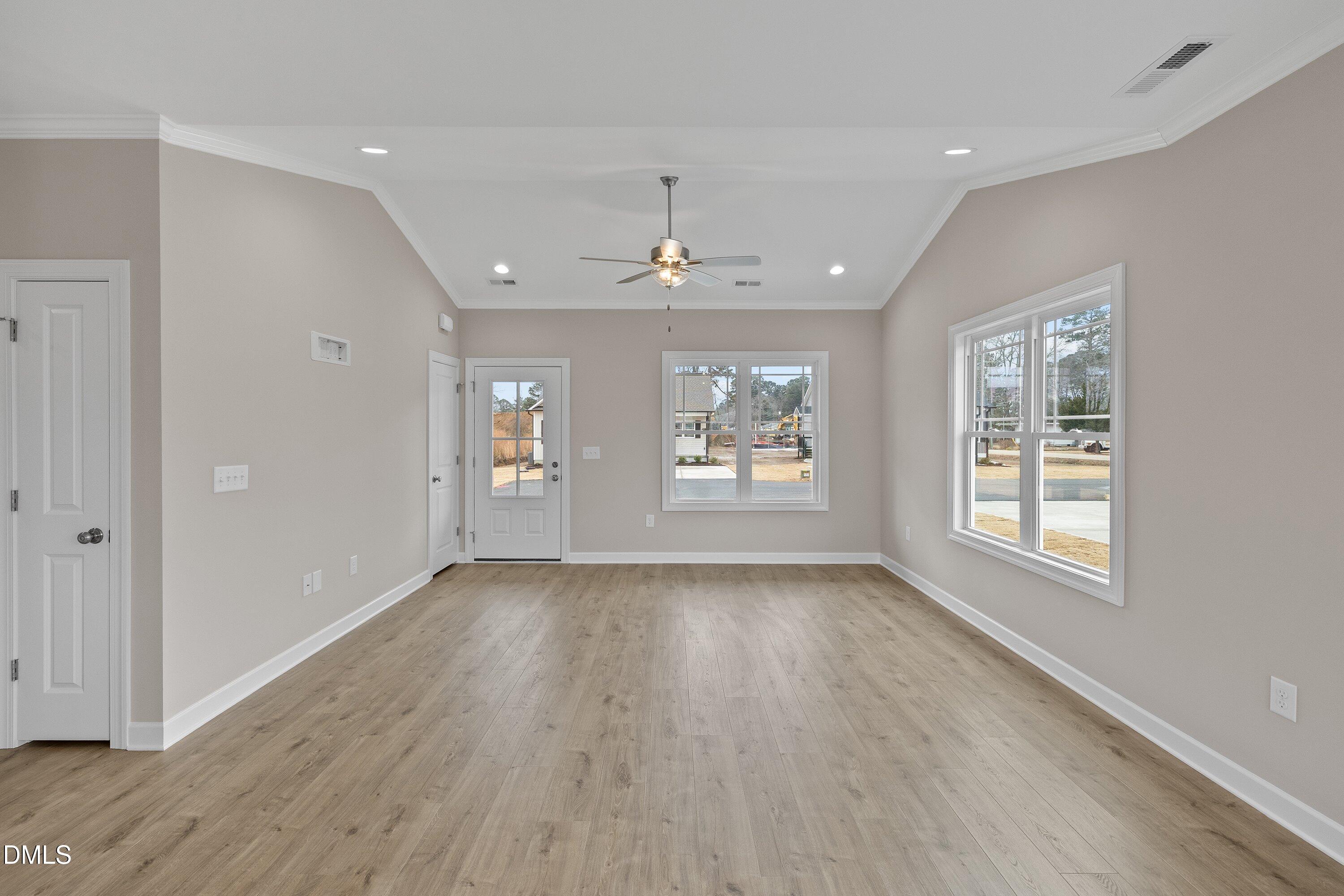 926 Micro Road West Selma, NC 27576 - Photo 11 of 41 wooden floor in an empty room with a window