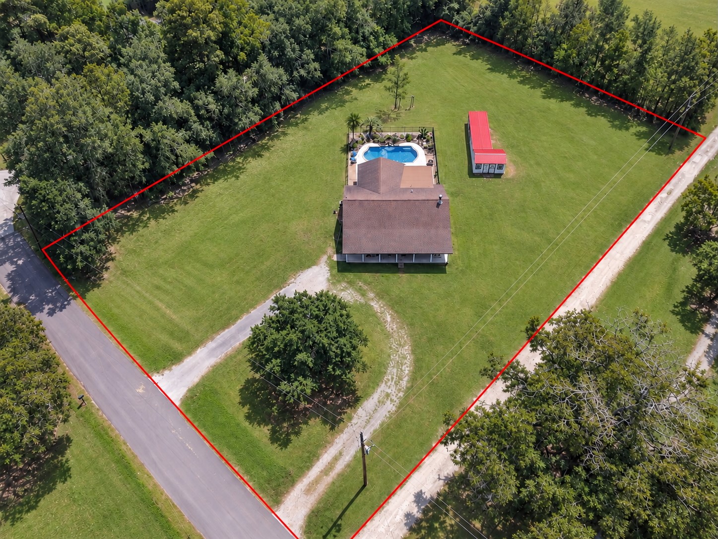 Incredible 1.5-acre property offering space, privacy, a pool, storage & so much more!