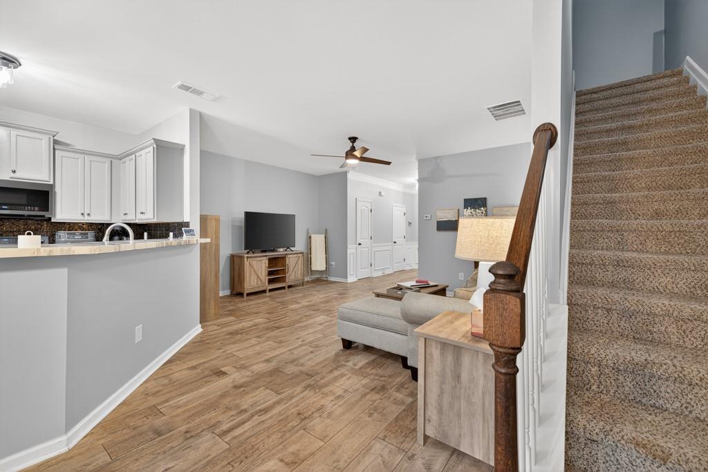 256 Valley Crossing Canton, GA 30114 - Photo 12 of 41 a living room with furniture and a flat screen tv