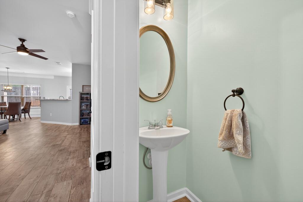256 Valley Crossing Canton, GA 30114 - Photo 13 of 41 a bathroom with a sink and mirror with bathtub