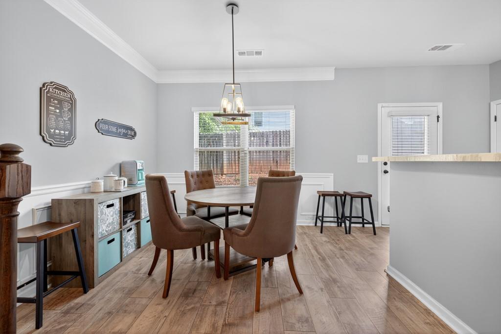 256 Valley Crossing Canton, GA 30114 - Photo 17 of 41 a view of a dining room with furniture window and wooden floor