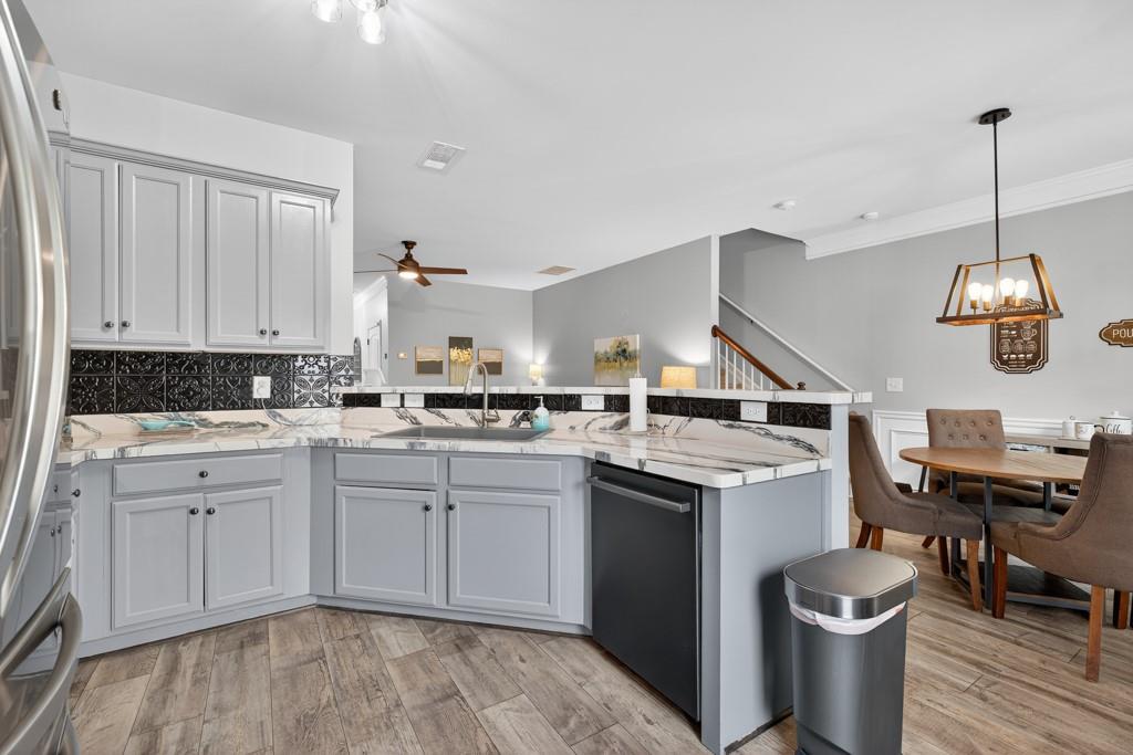 256 Valley Crossing Canton, GA 30114 - Photo 20 of 41 a kitchen with a stove sink and cabinets