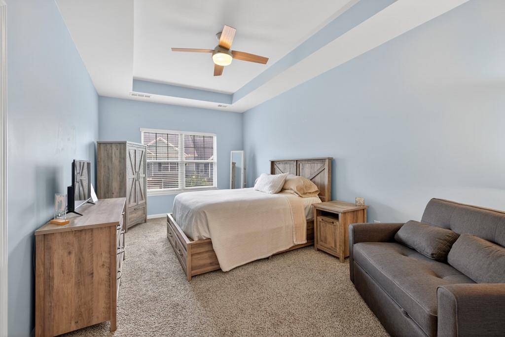 256 Valley Crossing Canton, GA 30114 - Photo 25 of 41 a bedroom with a bed and wooden floor