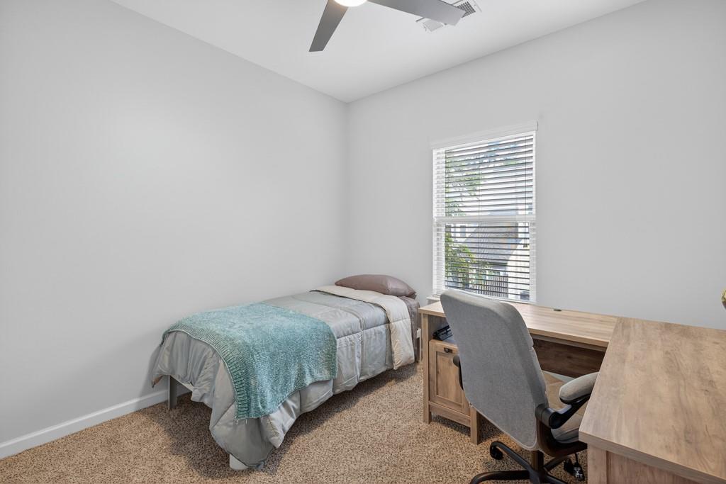 256 Valley Crossing Canton, GA 30114 - Photo 30 of 41 a bed sitting in a room next to a window