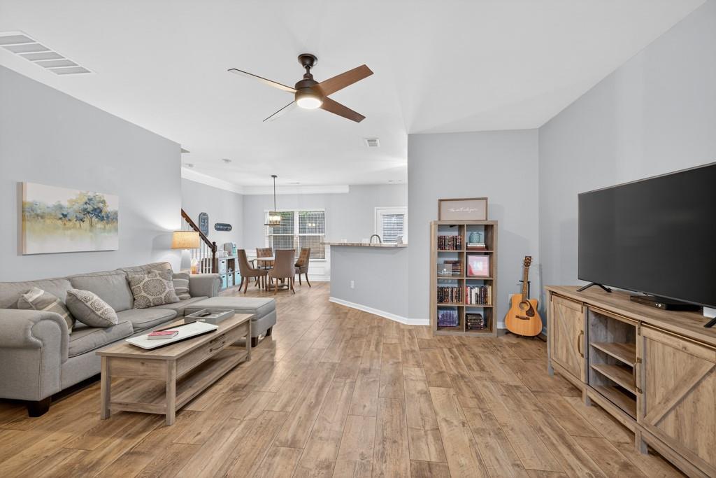 256 Valley Crossing Canton, GA 30114 - Photo 9 of 41 a living room with furniture and a flat screen tv