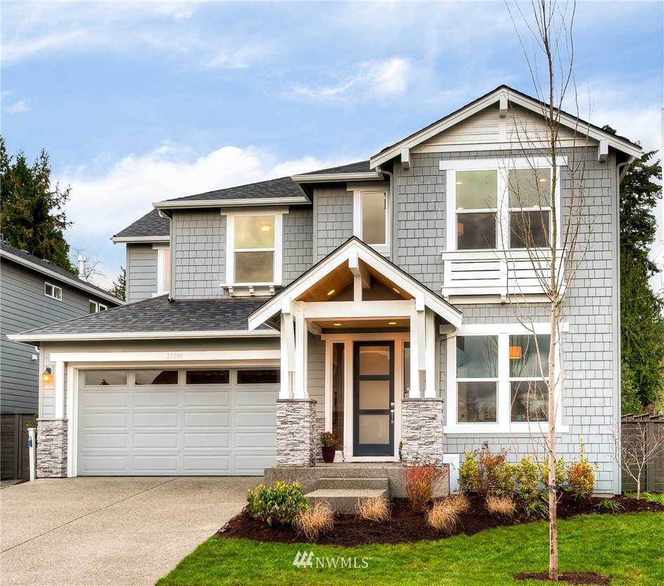 3 233rd Place Southeast Bothell, WA 98021 - Photo 1 of 16 a front view of a house with a yard