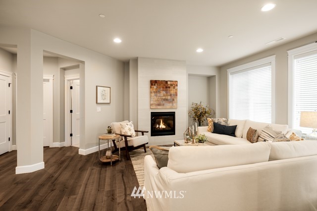 3 233rd Place Southeast Bothell, WA 98021 - Photo 11 of 16 a living room with furniture and a fireplace