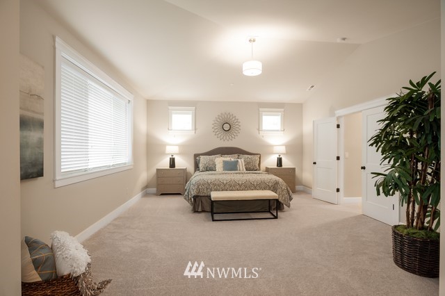3 233rd Place Southeast Bothell, WA 98021 - Photo 14 of 16 a bedroom with a bed and a potted plant