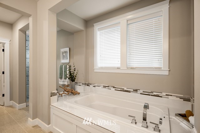 3 233rd Place Southeast Bothell, WA 98021 - Photo 16 of 16 a bathroom with a bathtub and shower