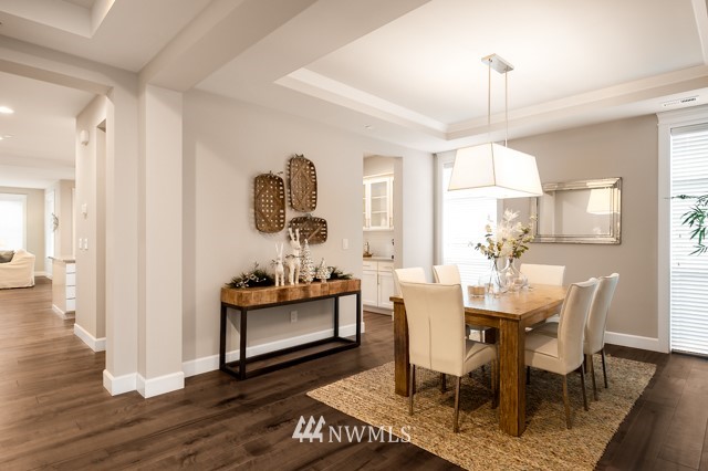 3 233rd Place Southeast Bothell, WA 98021 - Photo 5 of 16 a view of a dining room with furniture window and wooden floor