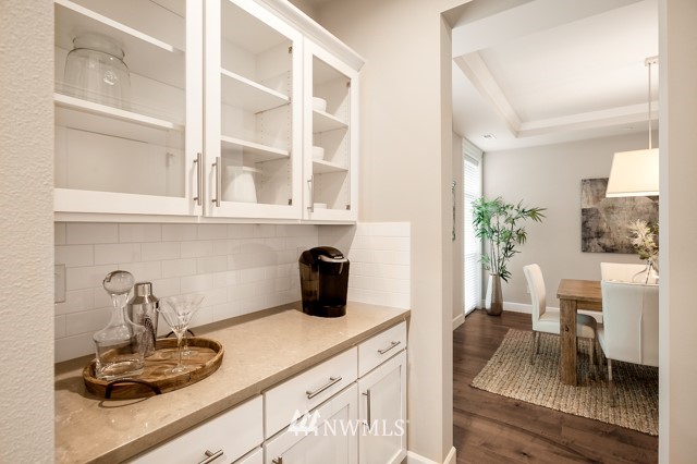 3 233rd Place Southeast Bothell, WA 98021 - Photo 6 of 16 a kitchen with a potted plant on the counter and cabinets