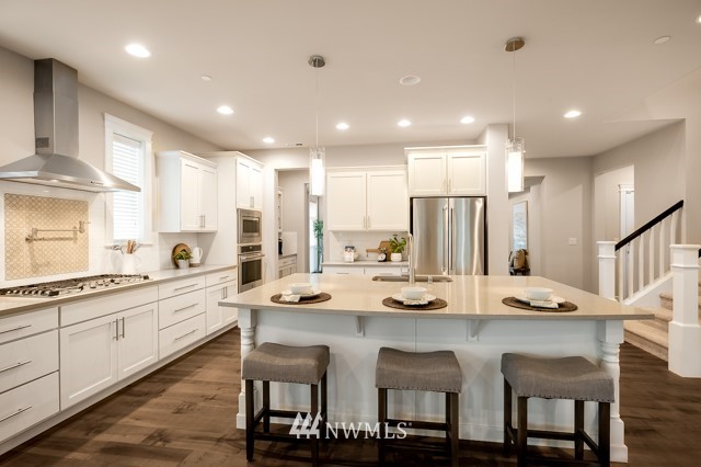 3 233rd Place Southeast Bothell, WA 98021 - Photo 7 of 16 a kitchen with appliances and cabinets