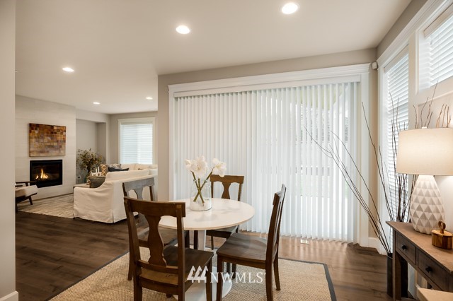 3 233rd Place Southeast Bothell, WA 98021 - Photo 9 of 16 a view of a dining room with furniture window and wooden floor