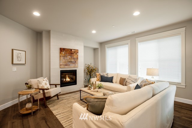 3 233rd Place Southeast Bothell, WA 98021 - Photo 10 of 16 a living room with furniture and a fireplace