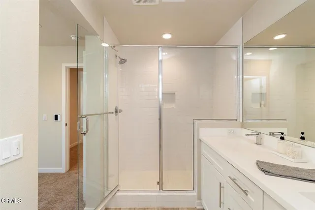 a view of a small space with wooden floor and a window