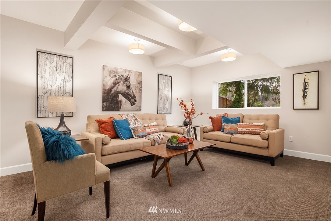 17522 West Riverside Drive Bothell, WA 98011 - Photo 21 of 28 a living room with furniture and a large window