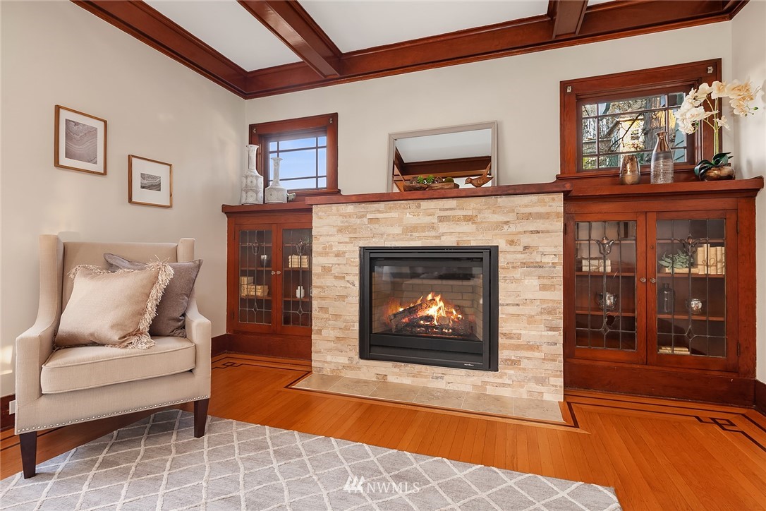 17522 West Riverside Drive Bothell, WA 98011 - Photo 5 of 28 a living room with furniture a flat screen tv and a fireplace