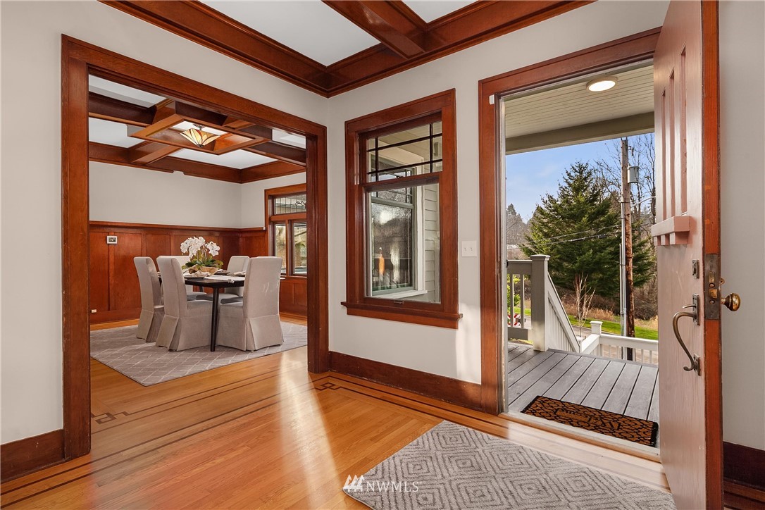 17522 West Riverside Drive Bothell, WA 98011 - Photo 6 of 28 a view of living room kitchen with furniture and large window