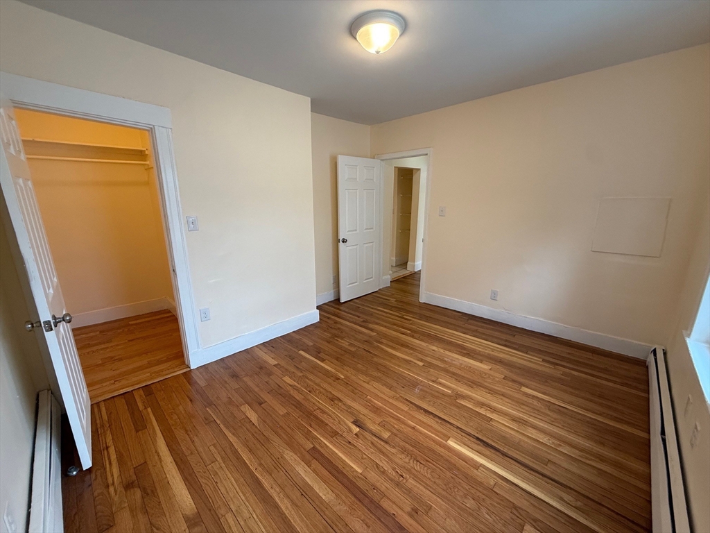 11 Dalrymple Street, Unit 3 Boston, MA 02130 - Photo 12 of 13 a view of a room with wooden floor and staircase