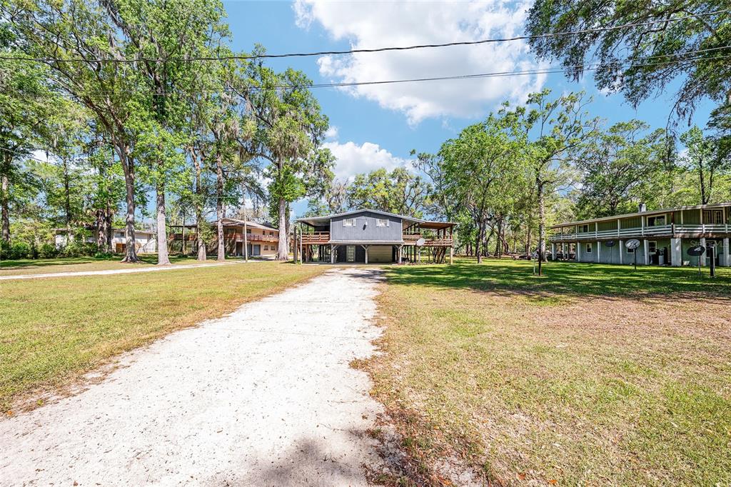 7870 Southwest 25th Place Bell, FL 32619 - Photo 24 of 99 a house with trees in the background