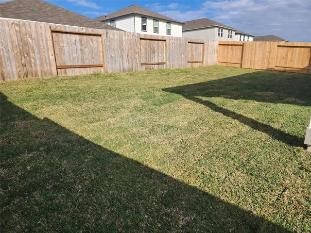 a view of a backyard of the house