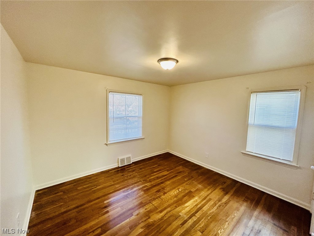 13414 Rockside Road Garfield Heights, OH 44125 - Photo 10 of 25 Empty room featuring dark hardwood / wood-style floors