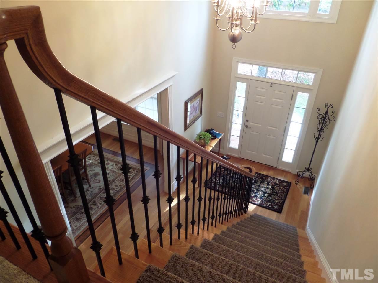 5236 Levering Mill Road Apex, NC 27539 - Photo 3 of 25 Two story foyer with wrought iron open staircase - hardwoods, with access to formal dining and Family Room.