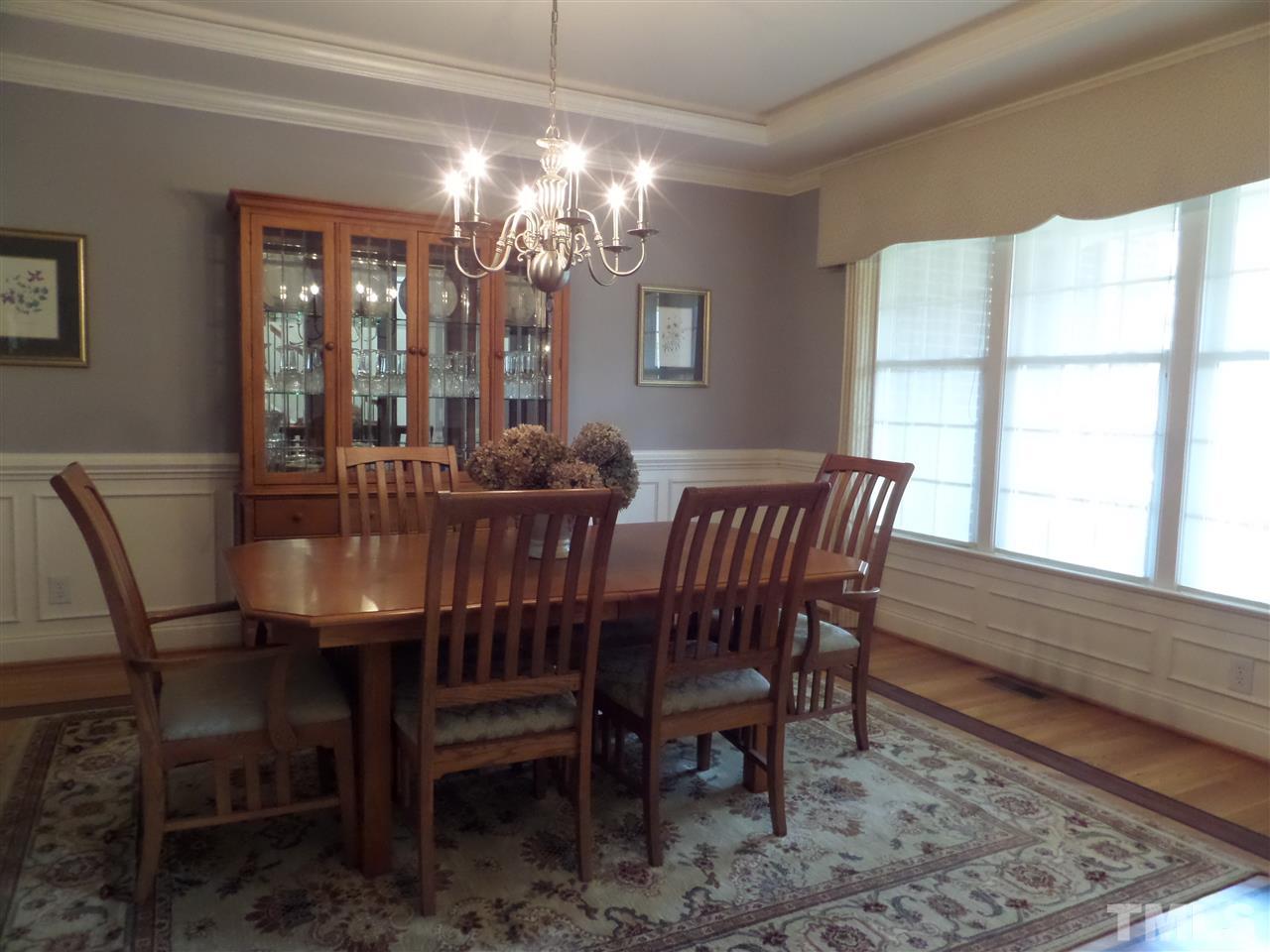 5236 Levering Mill Road Apex, NC 27539 - Photo 4 of 25 Formal Dining has hardwoods and beautiful woodwork with crown and wainscotting