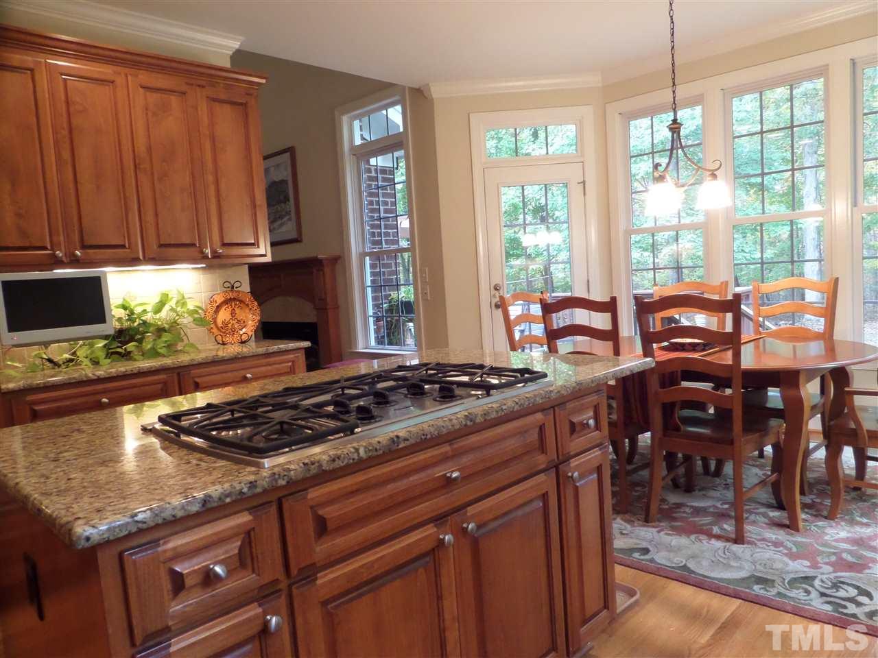 5236 Levering Mill Road Apex, NC 27539 - Photo 8 of 25 Gourmet kit with Island, gas cooktop, Loads of cabinets and granite counters, Lovely view to wooded backyard