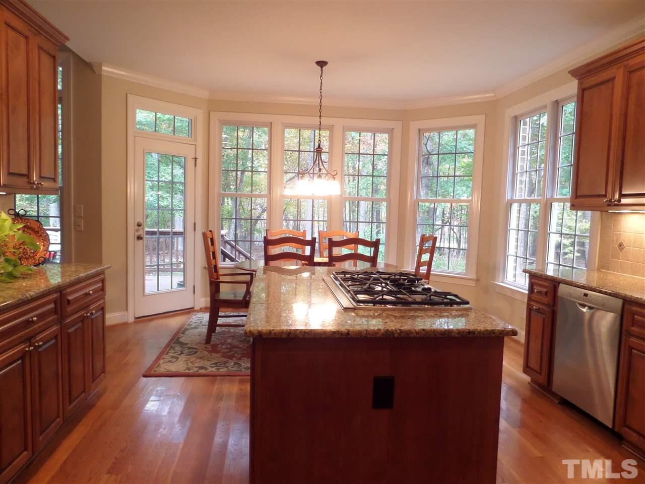 5236 Levering Mill Road Apex, NC 27539 - Photo 9 of 25 Breakfast Room and Kitchen has awesome views from the backyard windows