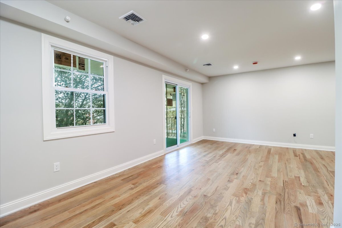 50 Greenhouse Road, Unit 42C Bridgeport, CT 06606 - Photo 8 of 26 Dining area: take notice of the hardwood floors and NEW windows!