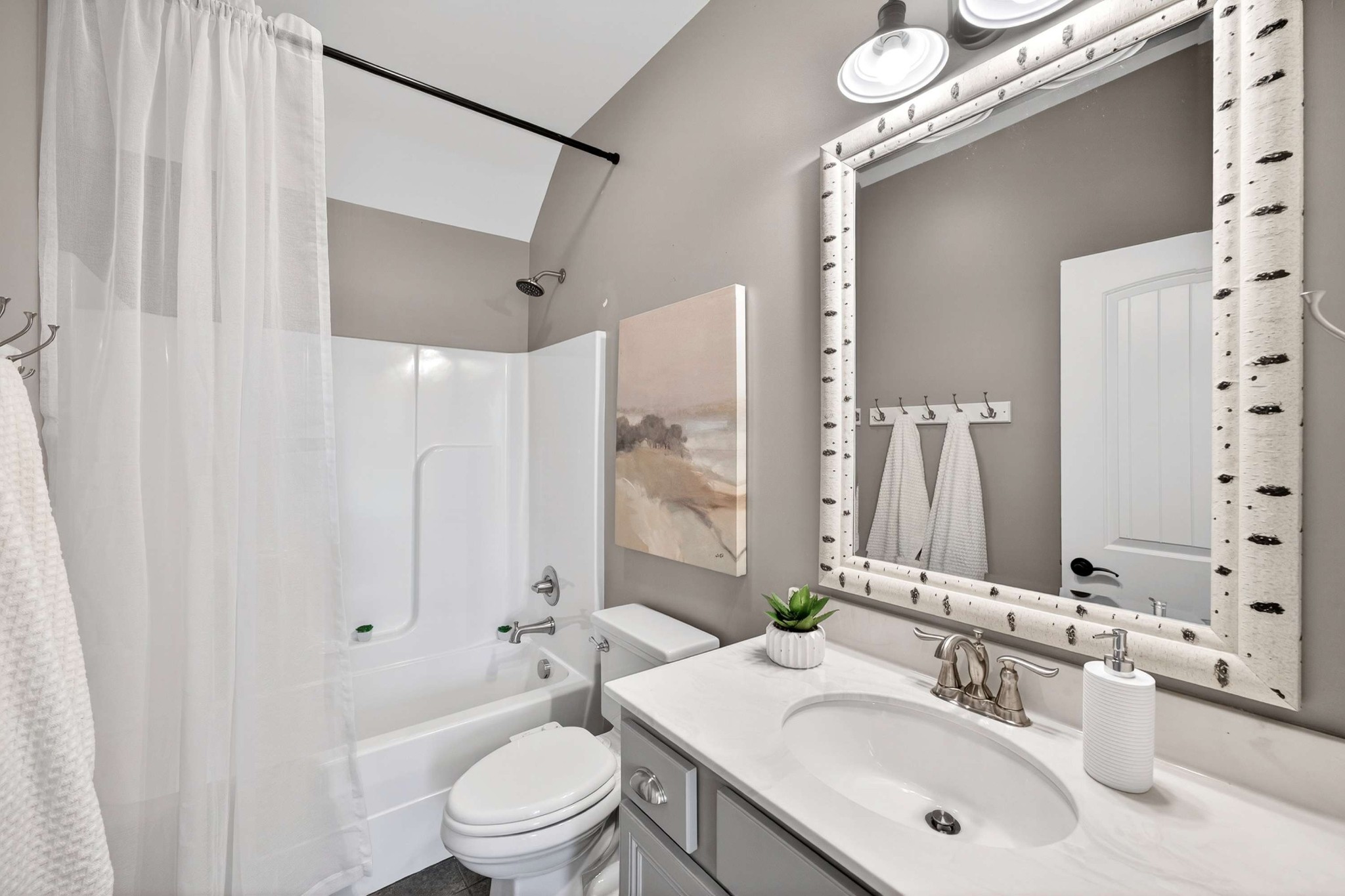 4852 Ash Hill Road Spring Hill, TN 37174 - Photo 41 of 45 a bathroom with a sink a toilet a mirror and shower