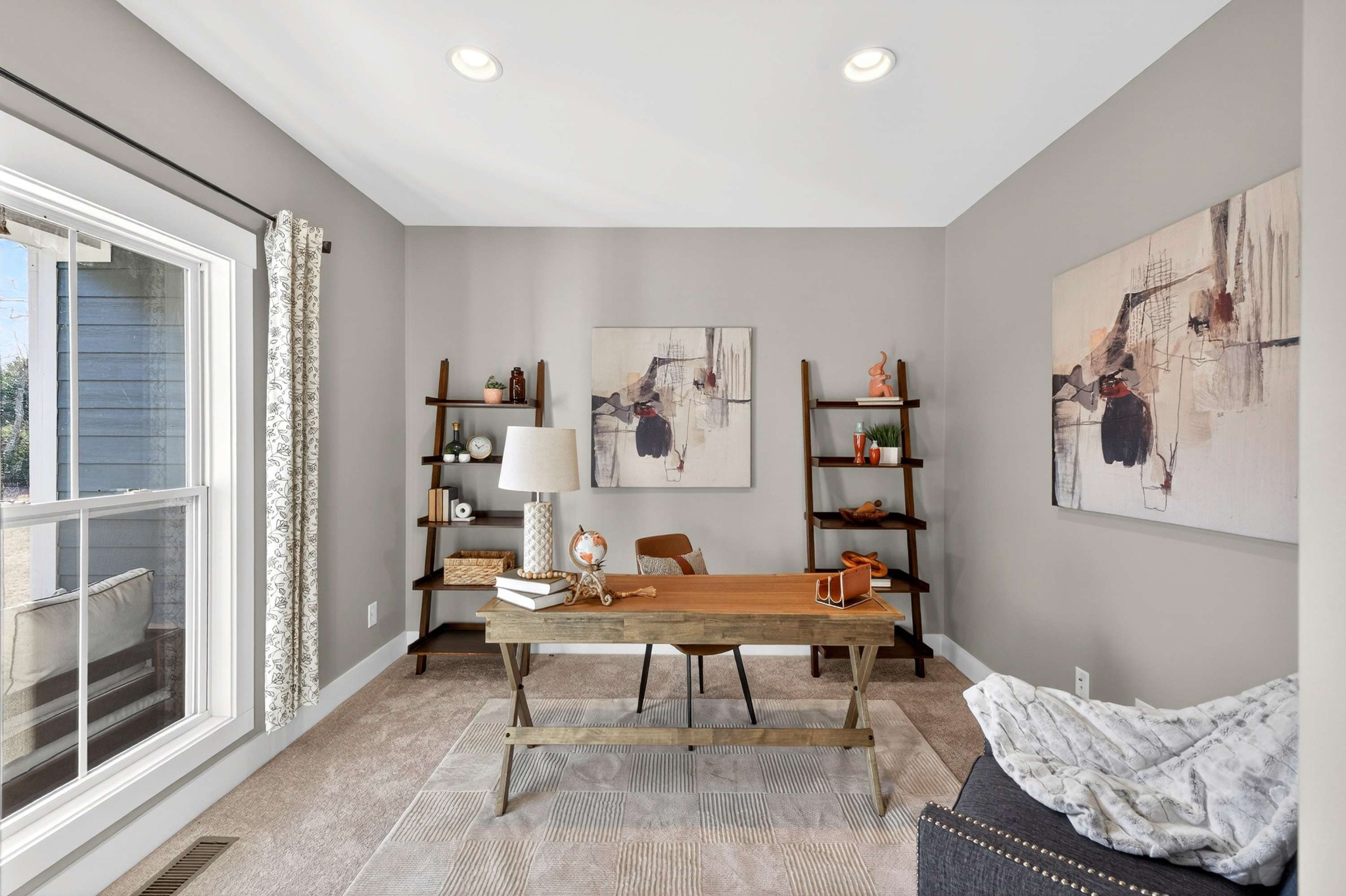 4852 Ash Hill Road Spring Hill, TN 37174 - Photo 10 of 45 a living room with furniture and book shelf