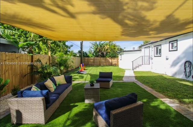470 Northeast 110th Street Miami, FL 33161 - Photo 16 of 20 a view of backyard with seating area and green space