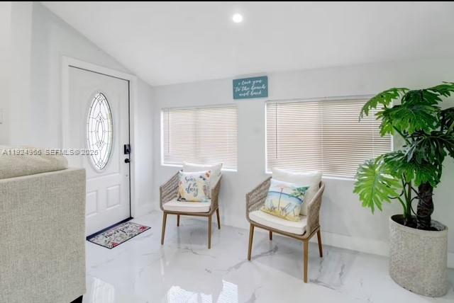 470 Northeast 110th Street Miami, FL 33161 - Photo 3 of 20 a living room with furniture and a potted plant