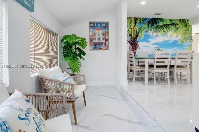 470 Northeast 110th Street Miami, FL 33161 - Photo 4 of 20 a dining room with furniture a window and a potted plant